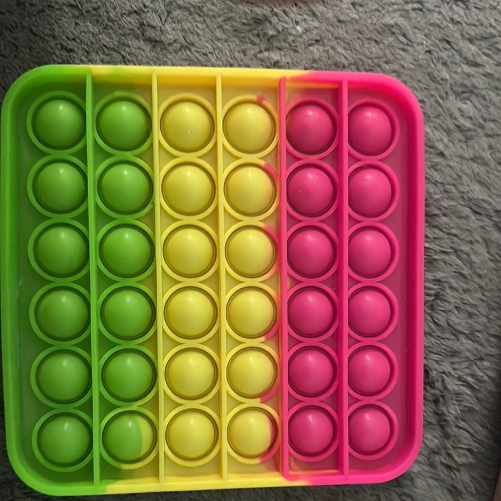 Vibrant Green, Yellow, and Pink Bubble Pop Toy